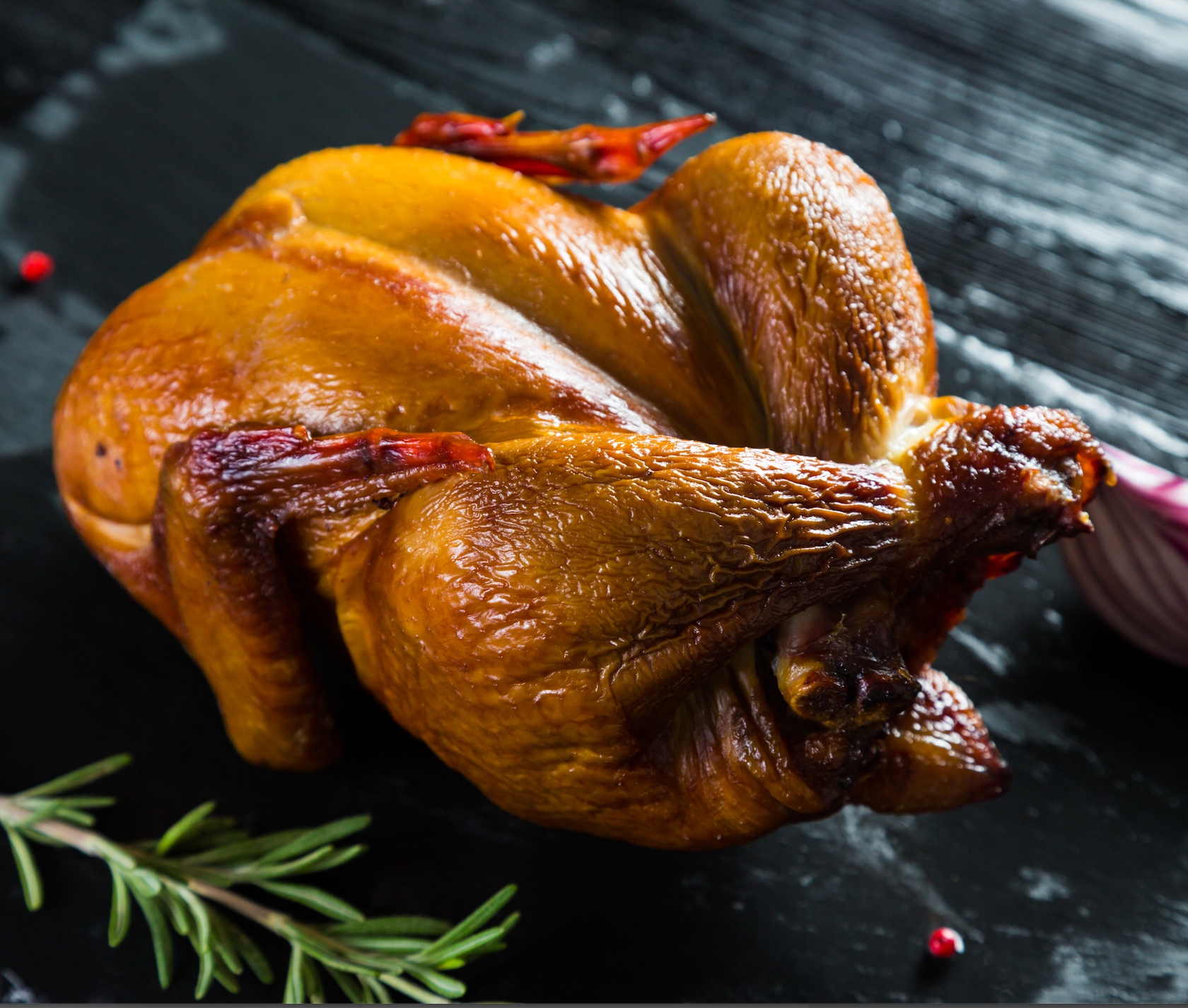 Beer can chicken in electric outlet smoker